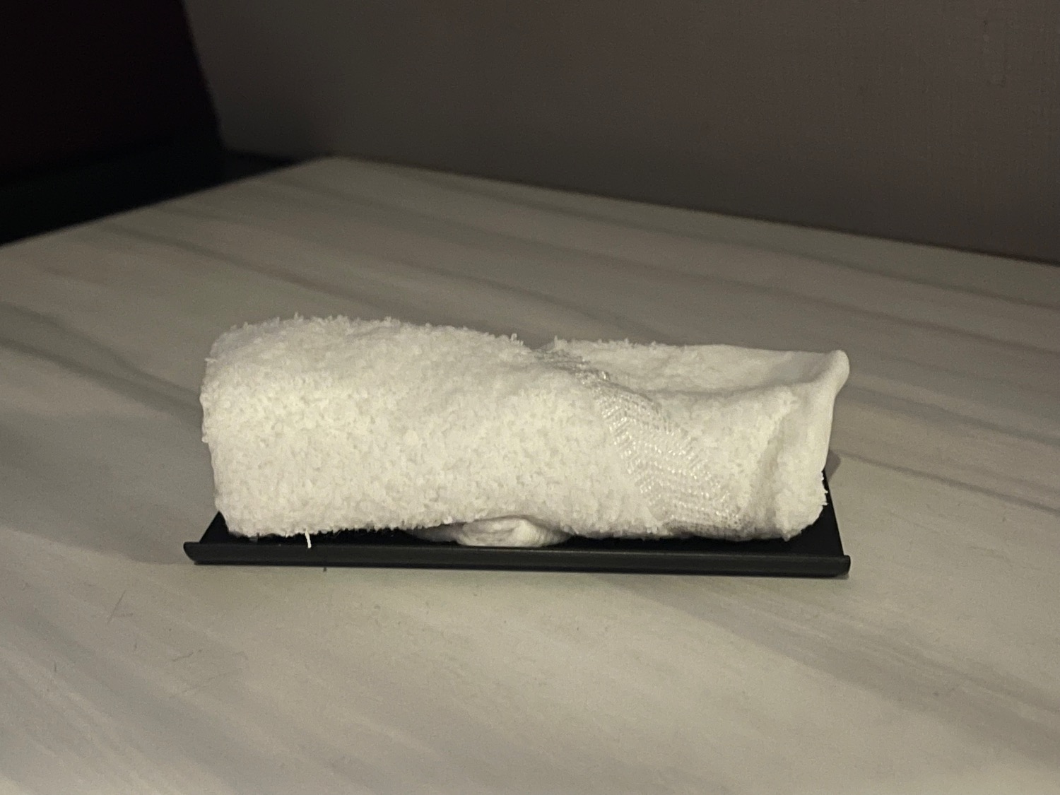 a towel on a black plate