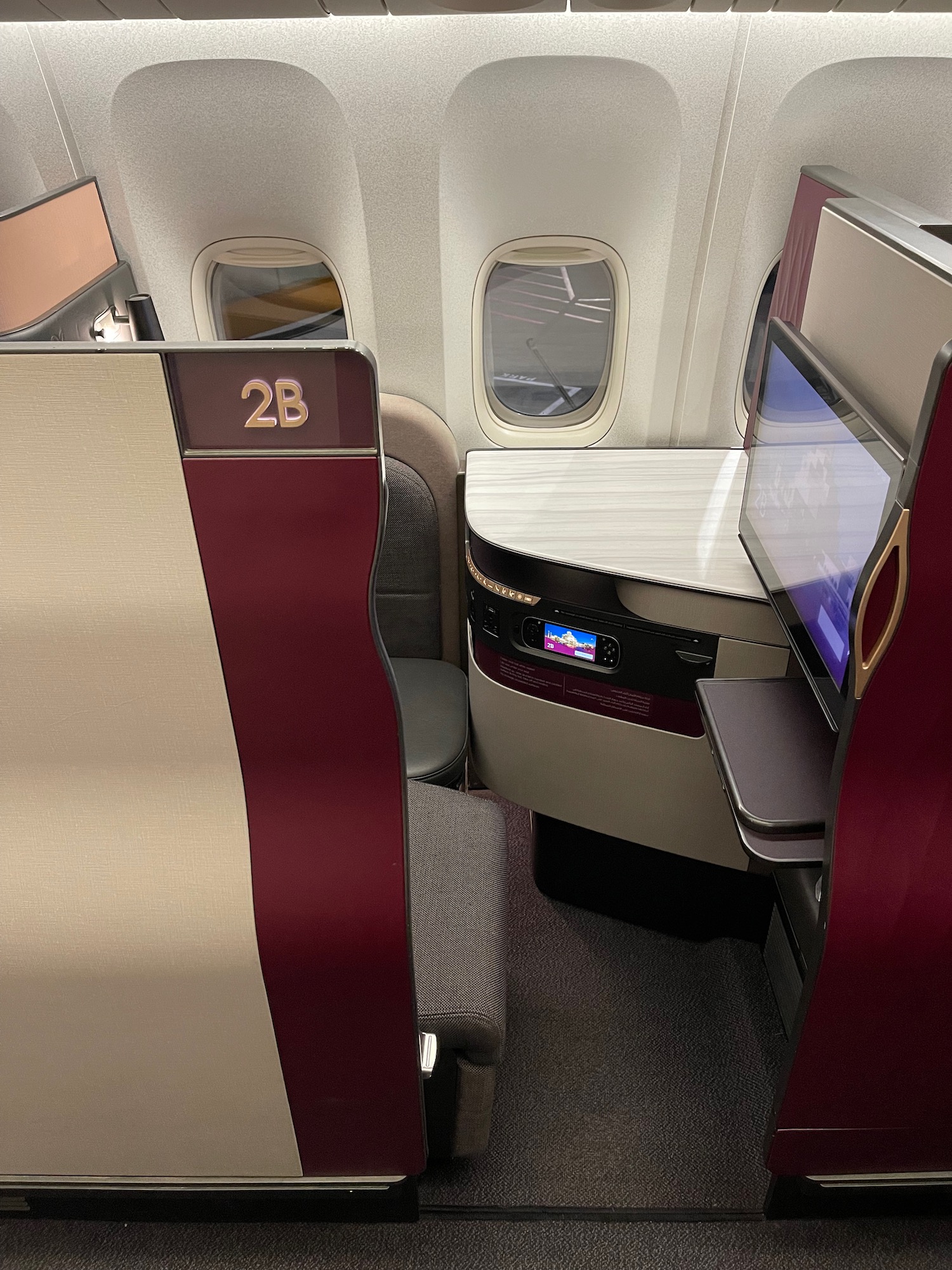 a seat and desk in an airplane