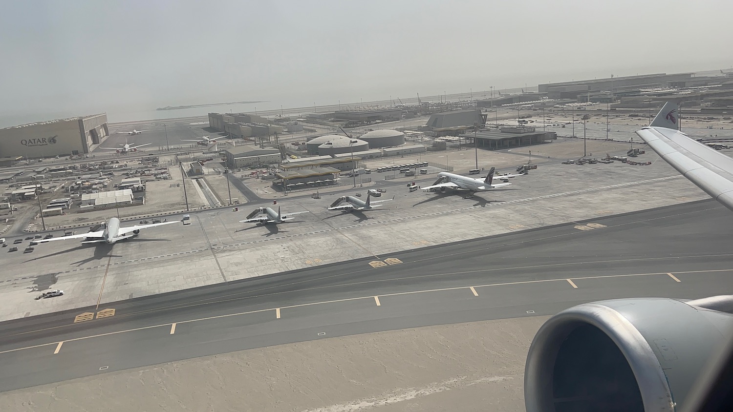 a group of airplanes on a runway