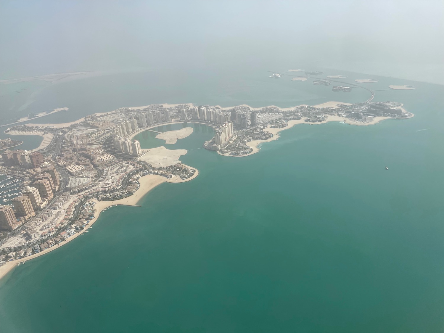 an aerial view of a city and water