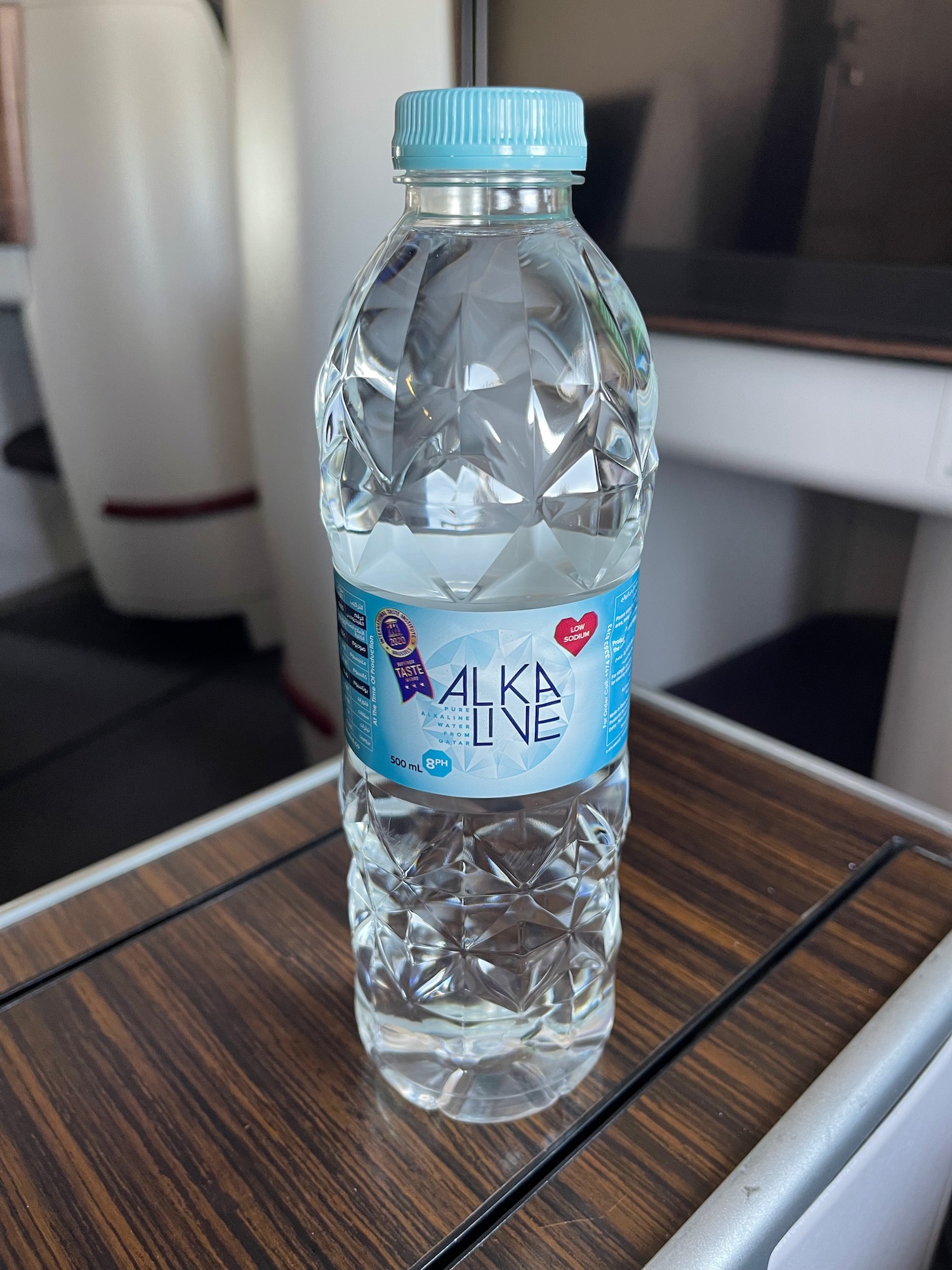 a plastic bottle of water on a table