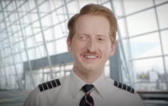 a man in uniform smiling