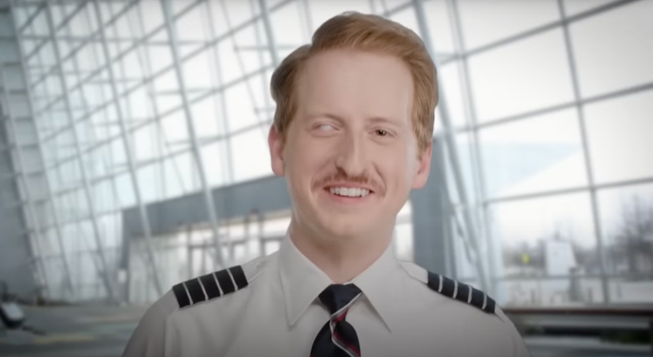 a man in uniform smiling