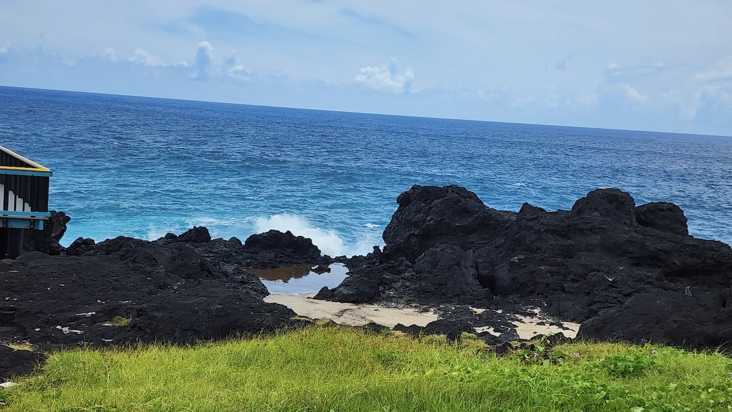 a rocky beach with a body of water