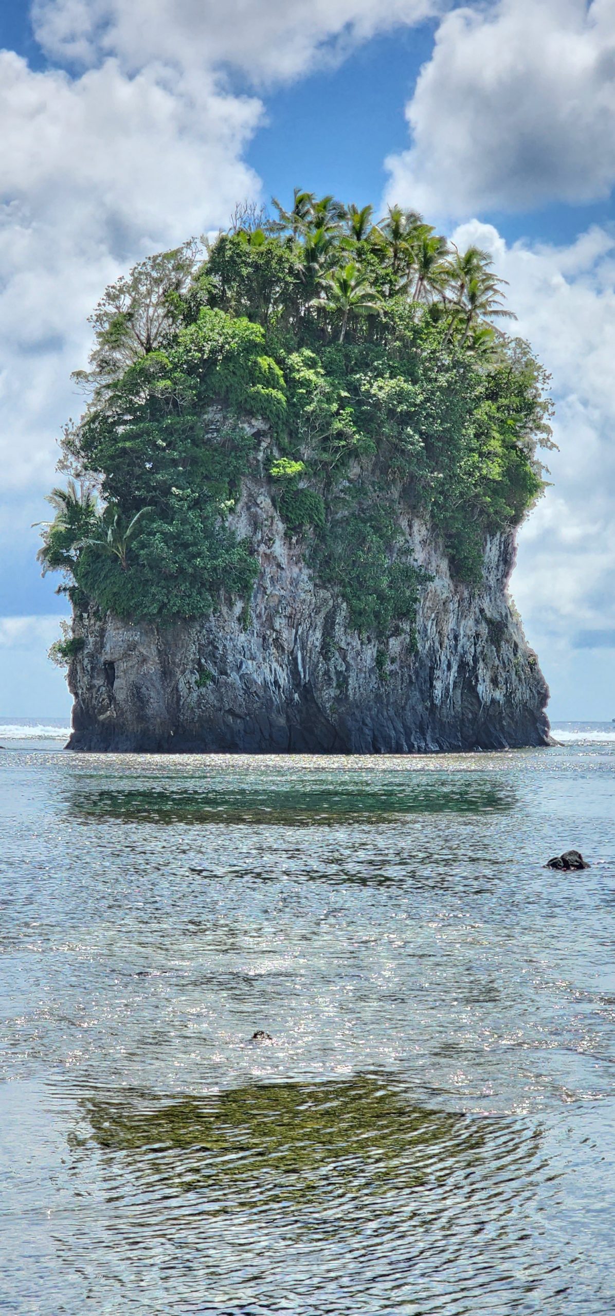 a rock island in the water