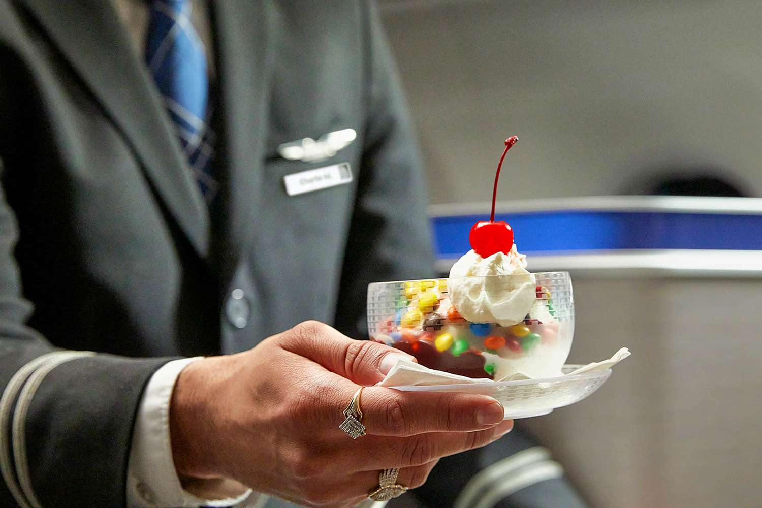 a person holding a dish of ice cream