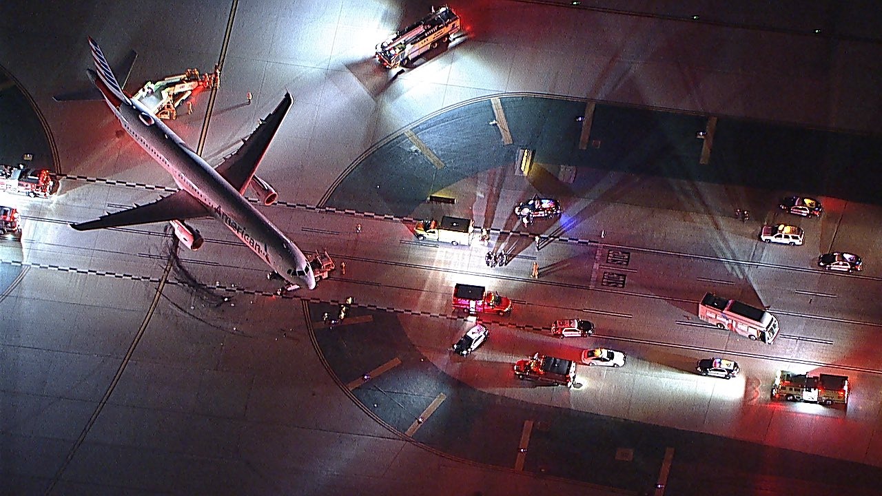 an airplane on the runway at night