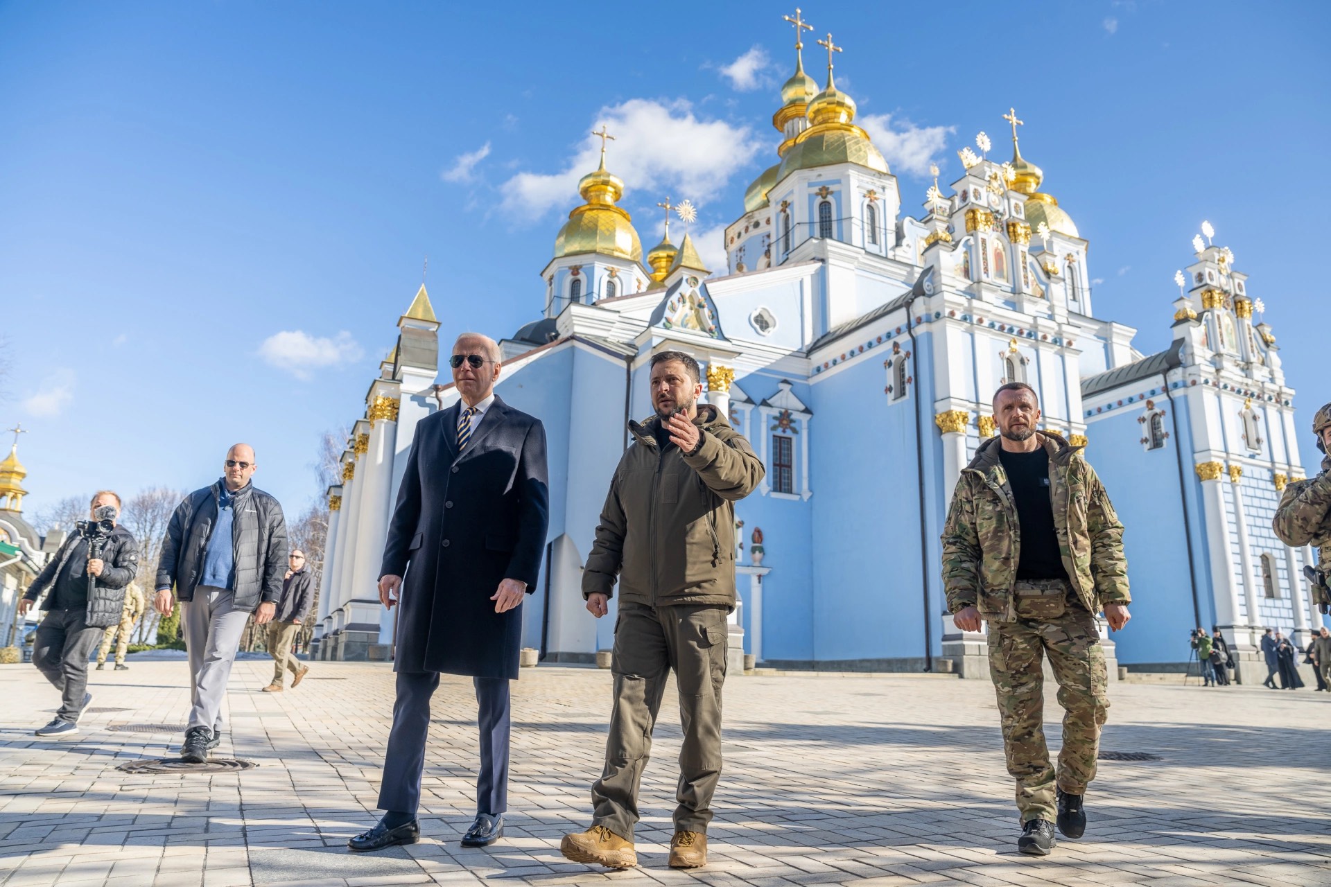 a group of men in front of a building