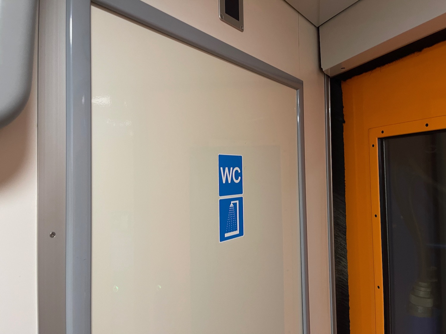 a white door with blue signs on it