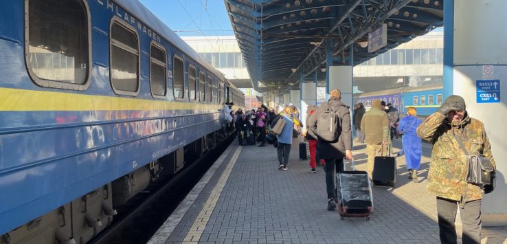 a group of people at a train station