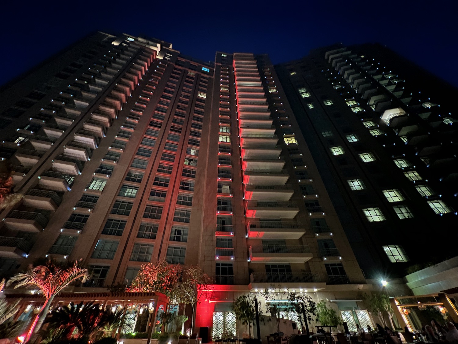 a tall building with red lights