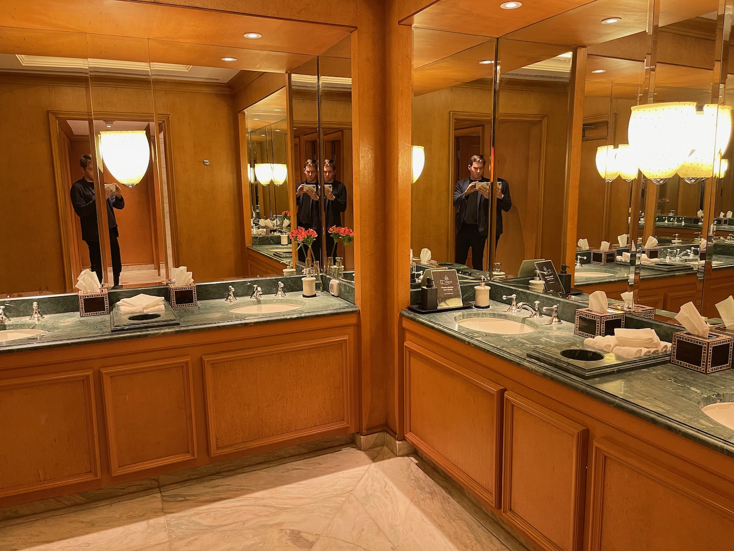 a bathroom with a couple of sinks and a mirror