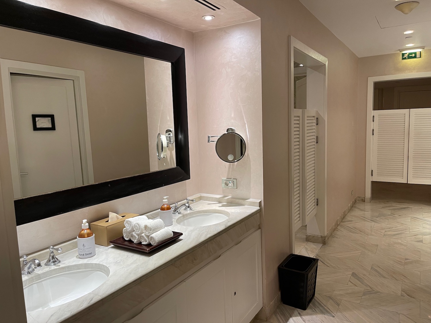 a bathroom with a mirror and sinks