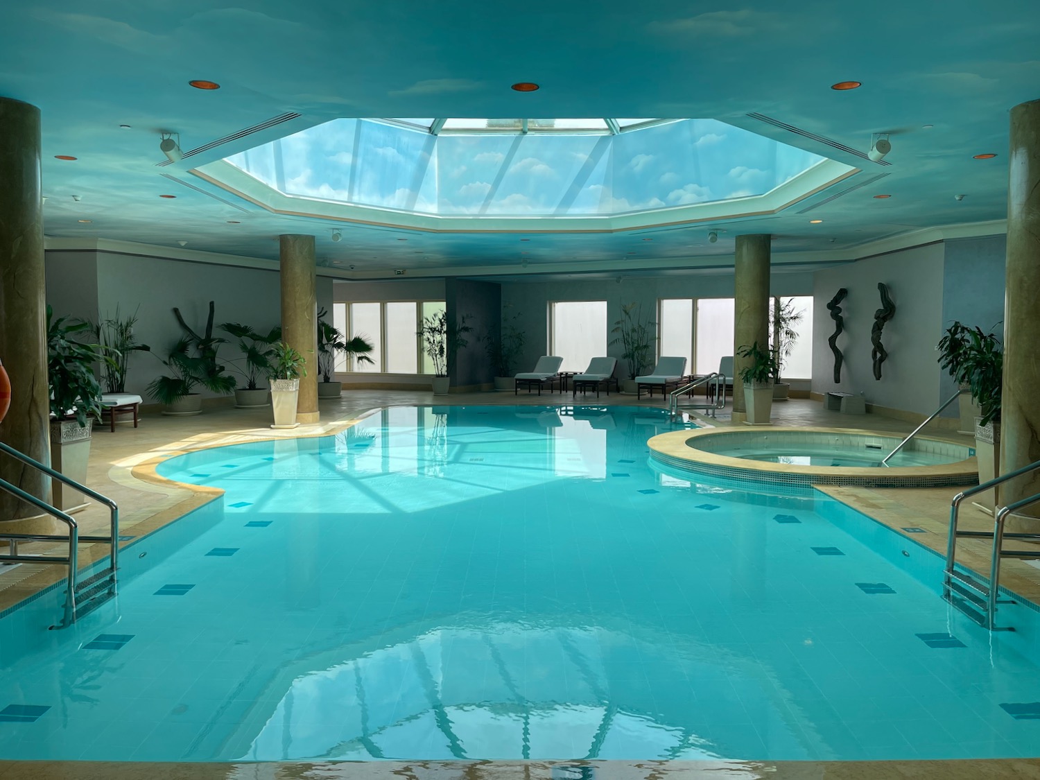 a swimming pool with a skylight