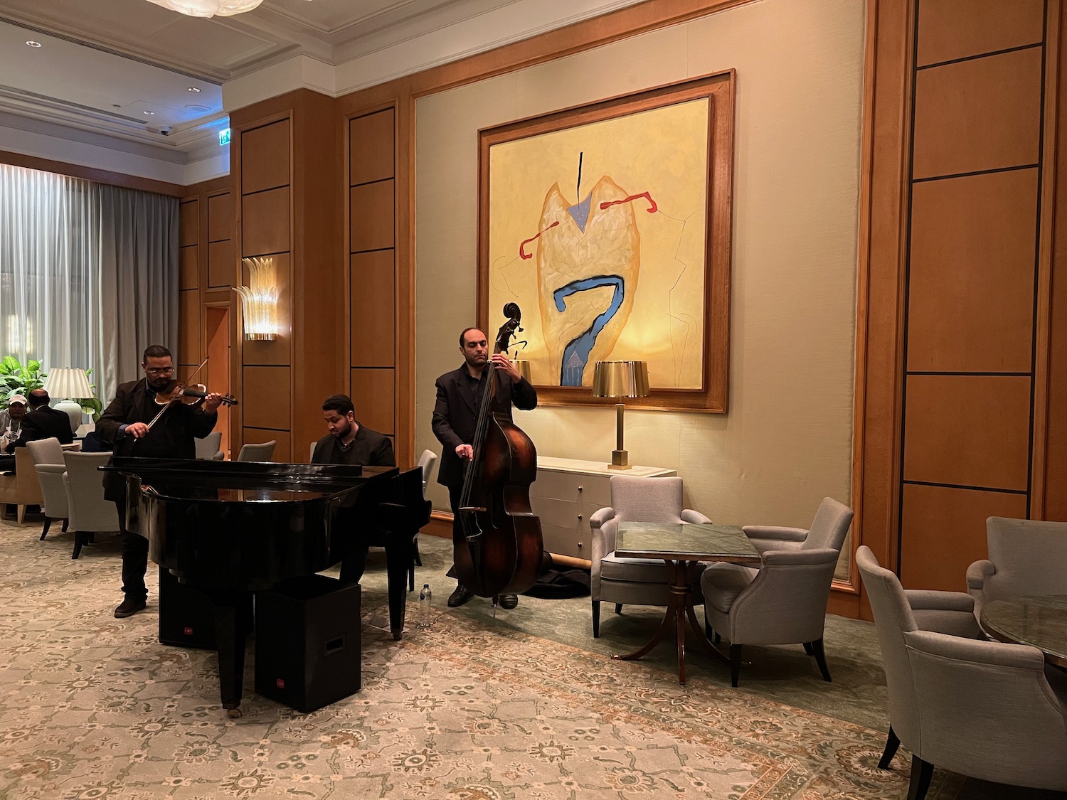 a group of people playing instruments in a room