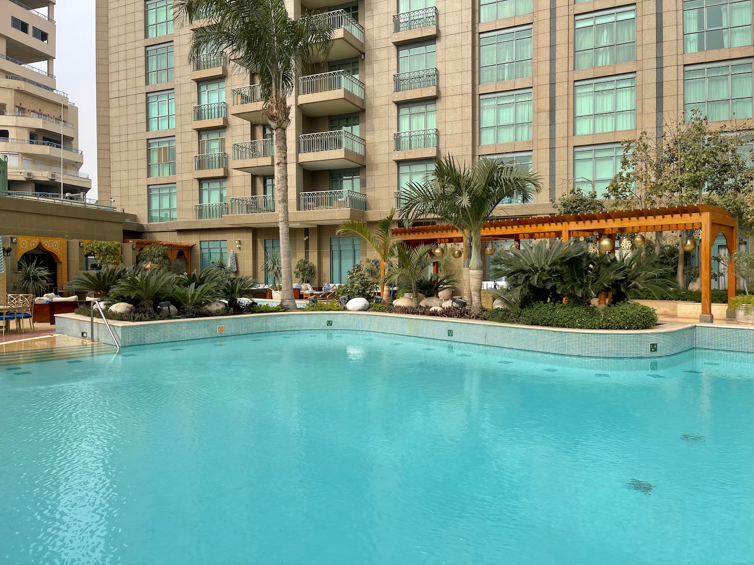 a swimming pool in front of a building