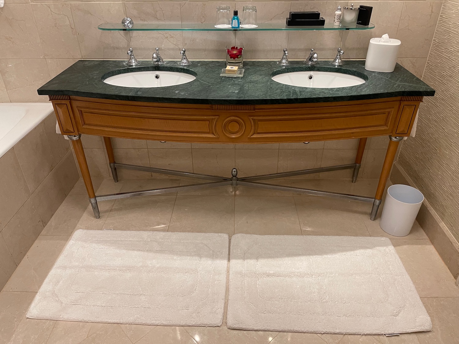 a bathroom with a marble countertop and two sinks