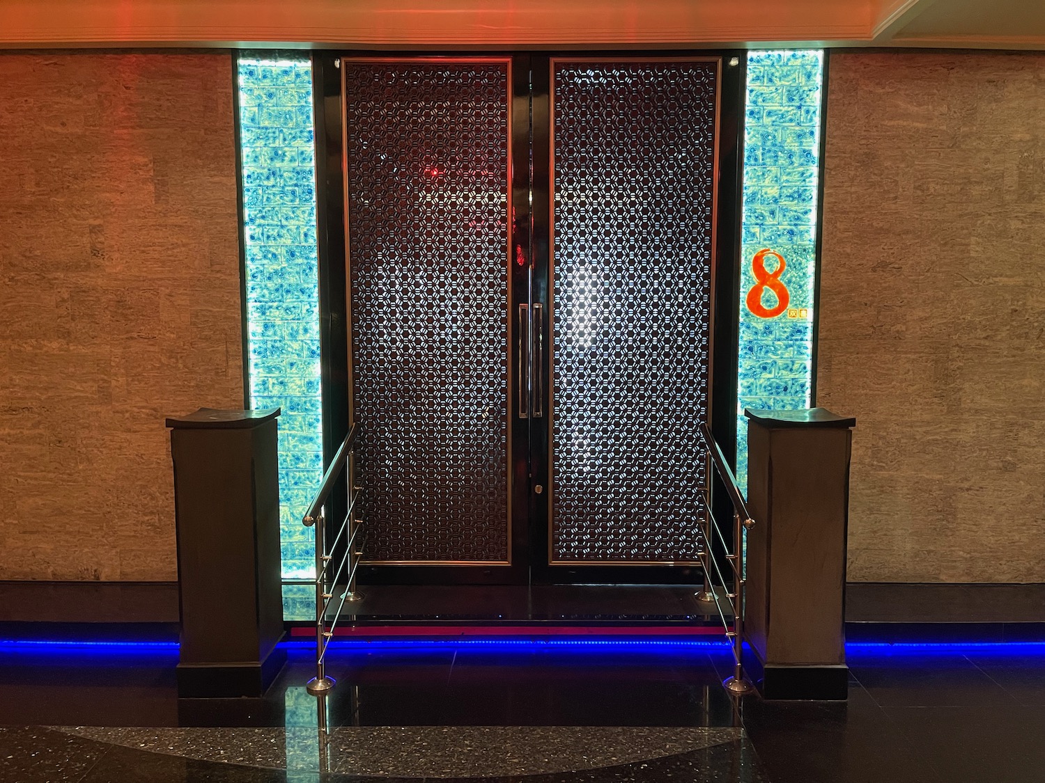 a double doors with a blue strip of light