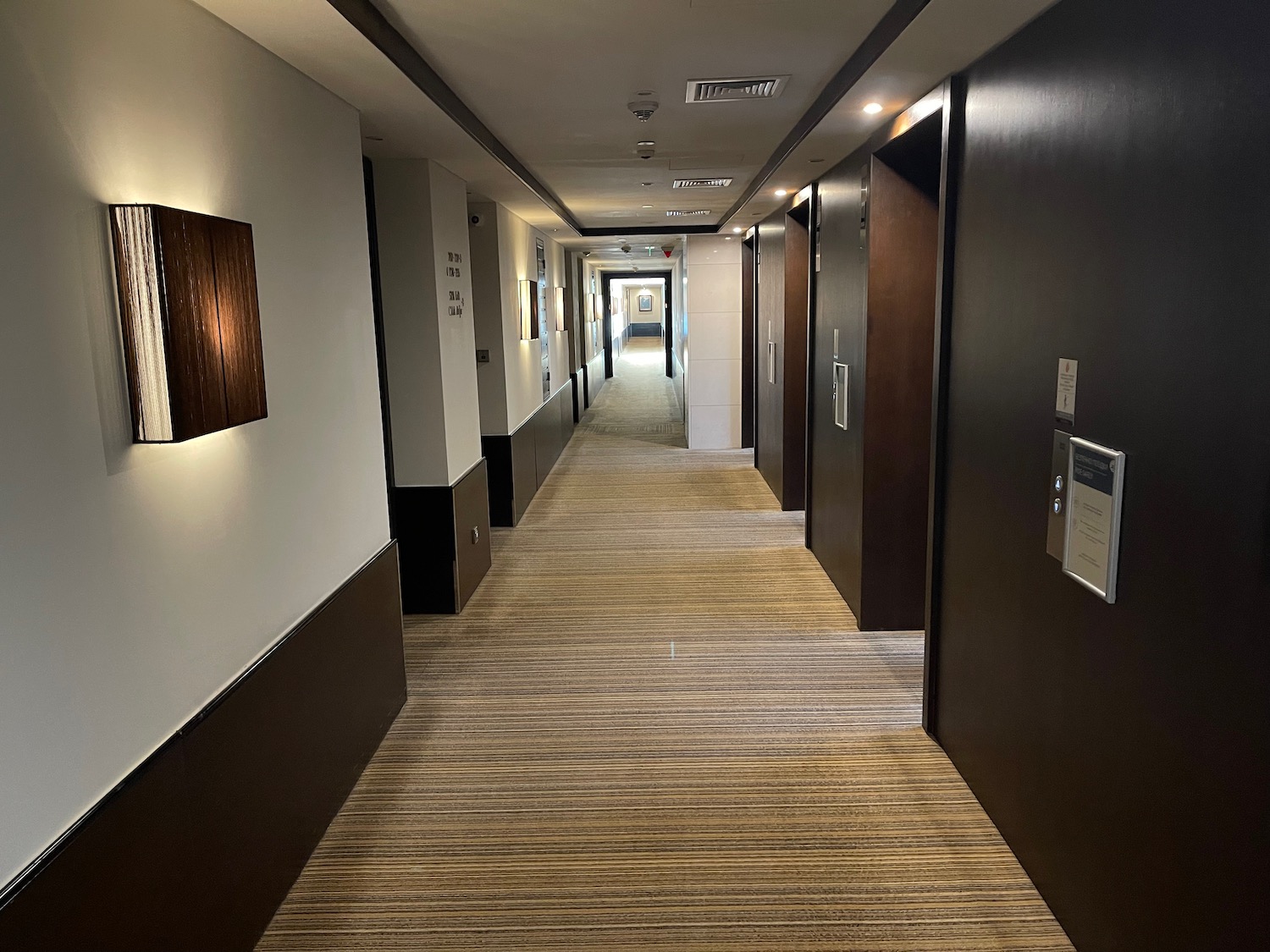 a hallway with brown walls and white walls