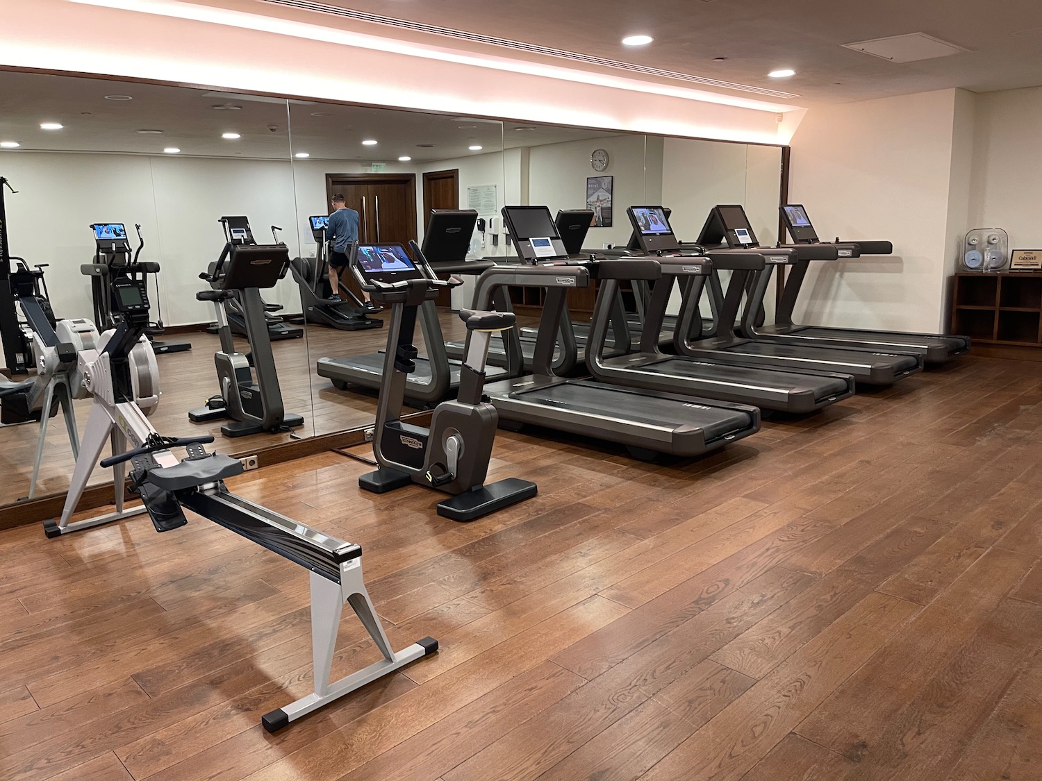 a room with treadmills and a mirror