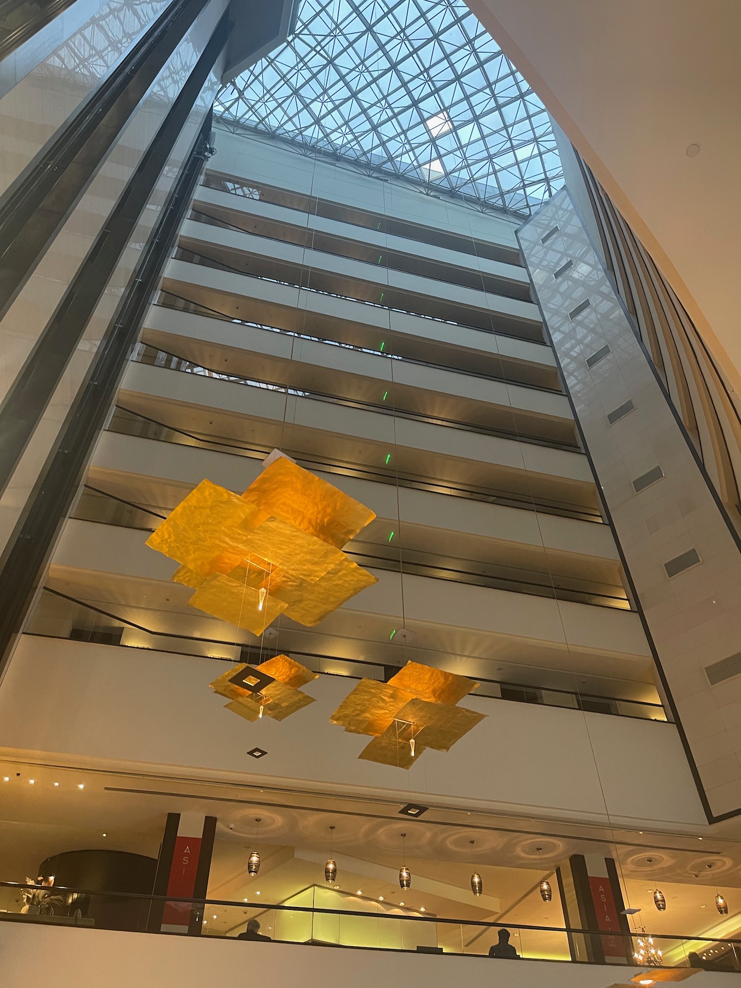 a building with a glass ceiling and a ceiling with a ceiling and a ceiling with a glass roof