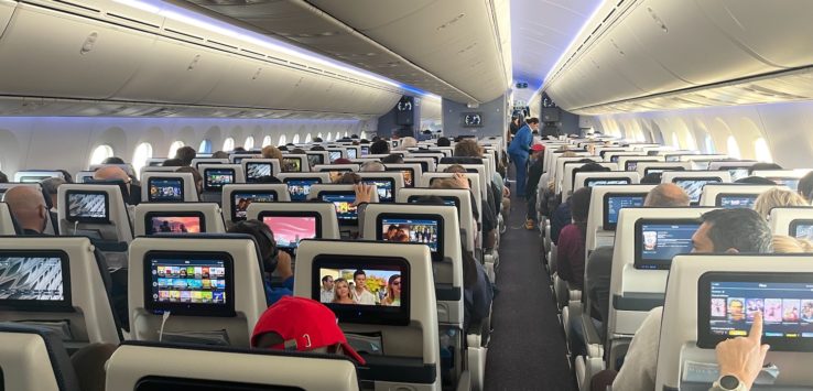 a group of people sitting in an airplane