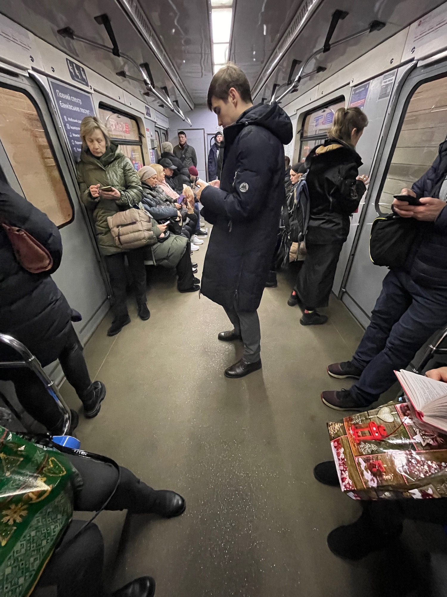 a man standing in a subway car