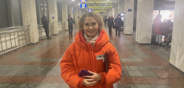 a woman in an orange coat