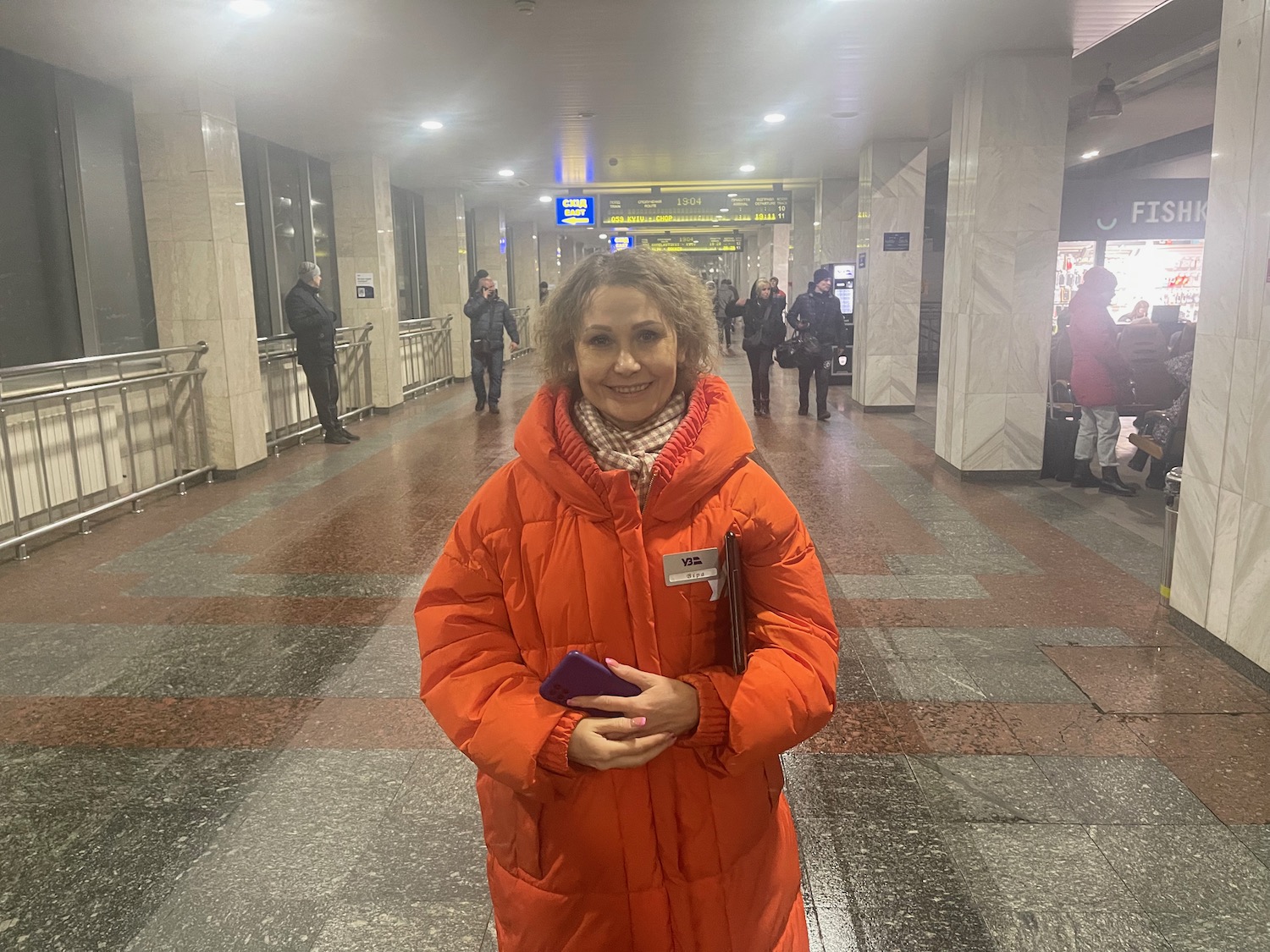 a woman in an orange coat