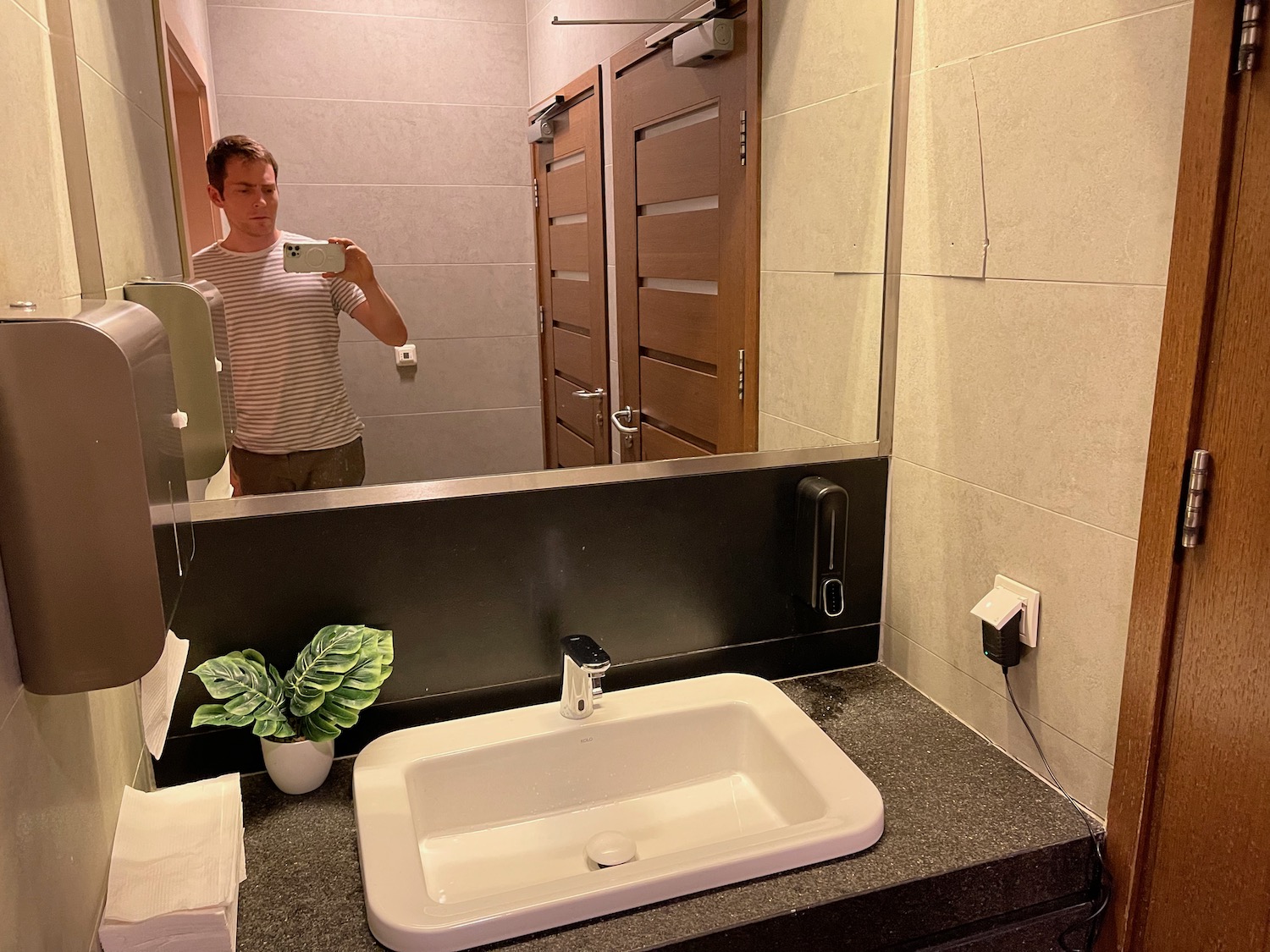 a man taking a selfie in a bathroom