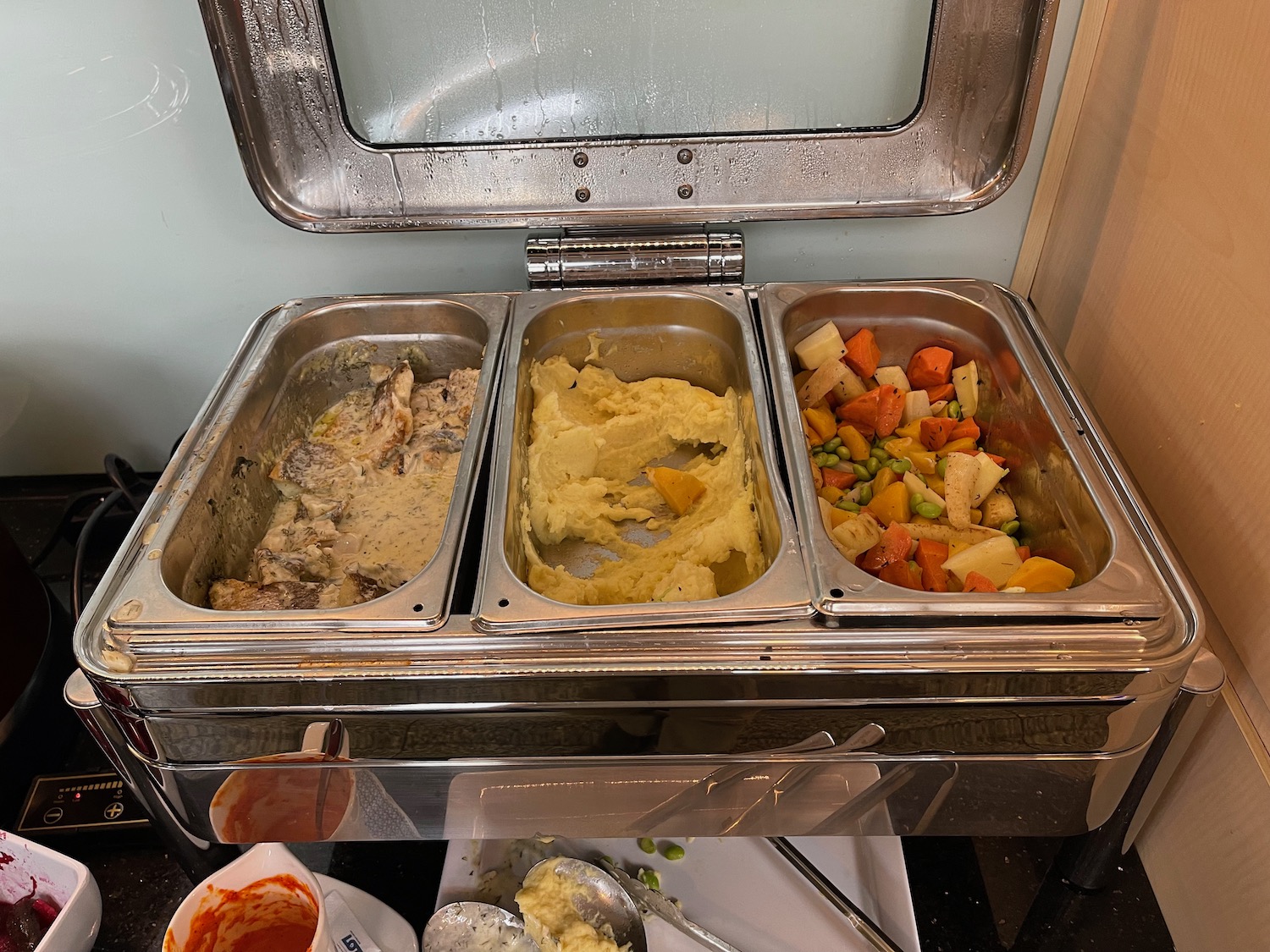 a trays of food in a buffet