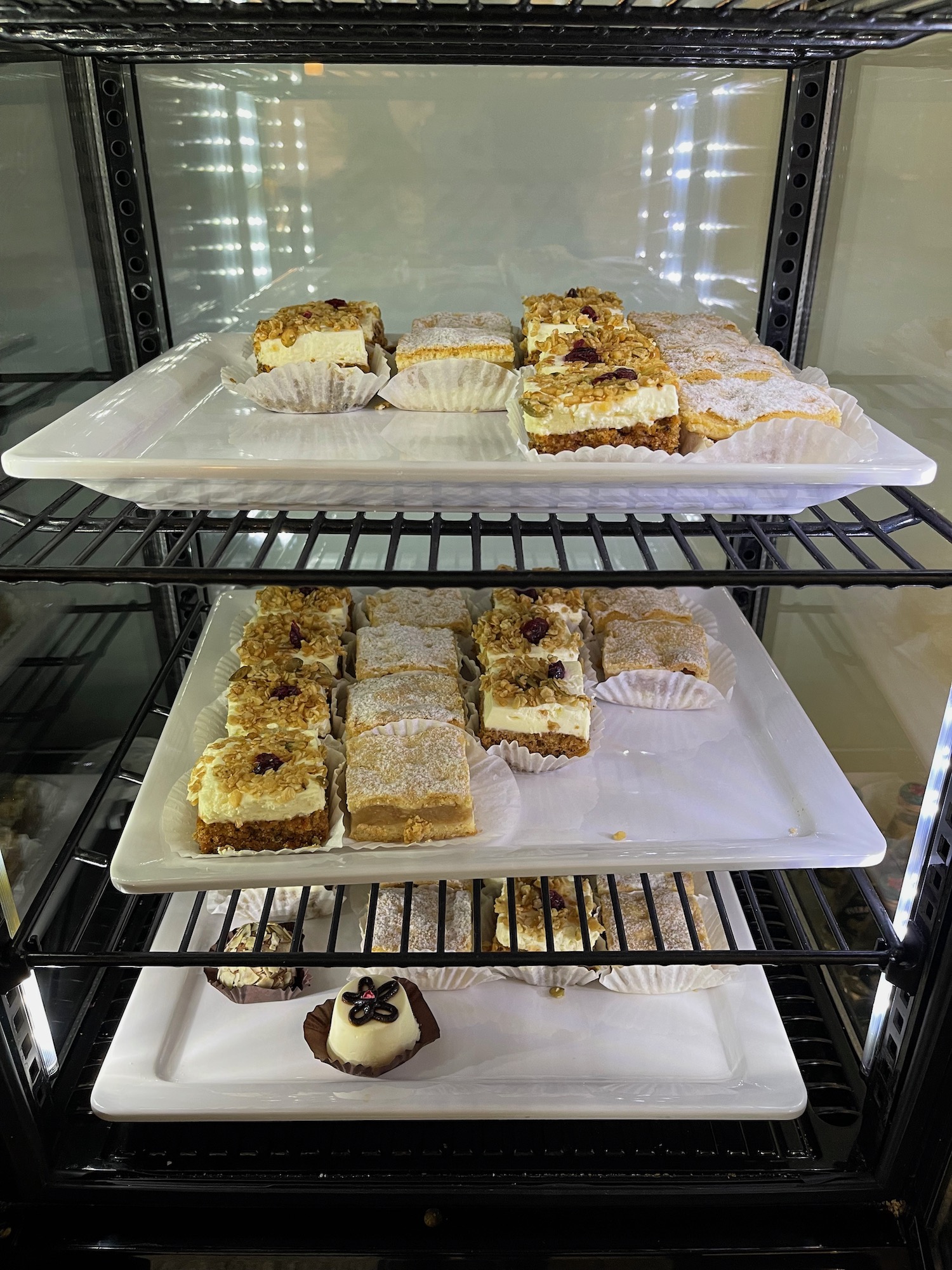 a trays of pastries on a shelf