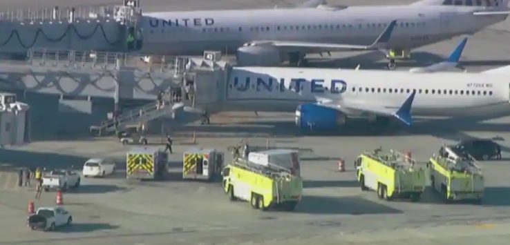 a group of airplanes parked on a runway