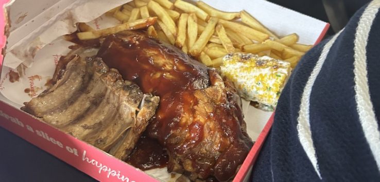 a box of ribs and french fries