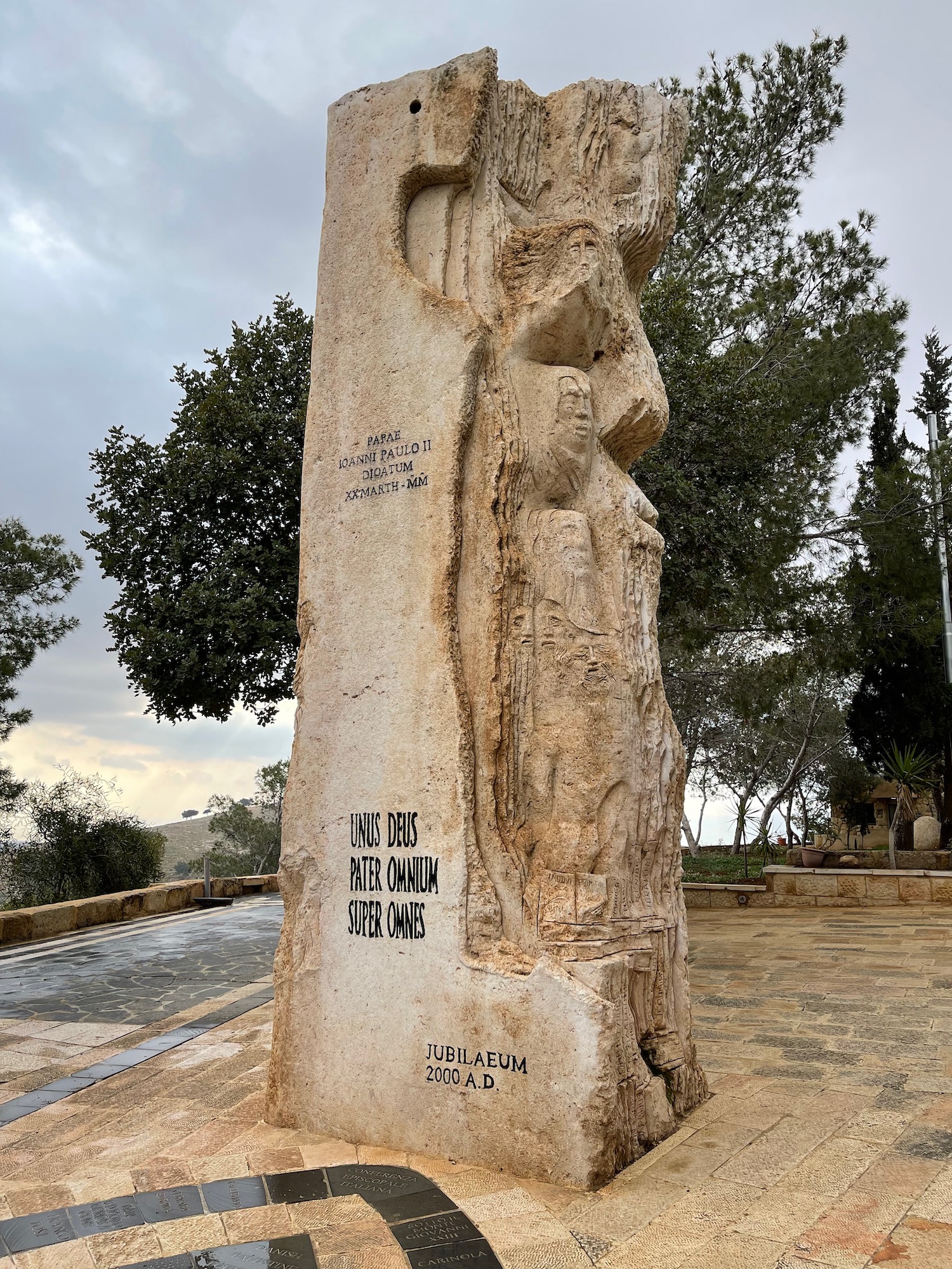 a large stone pillar with writing on it