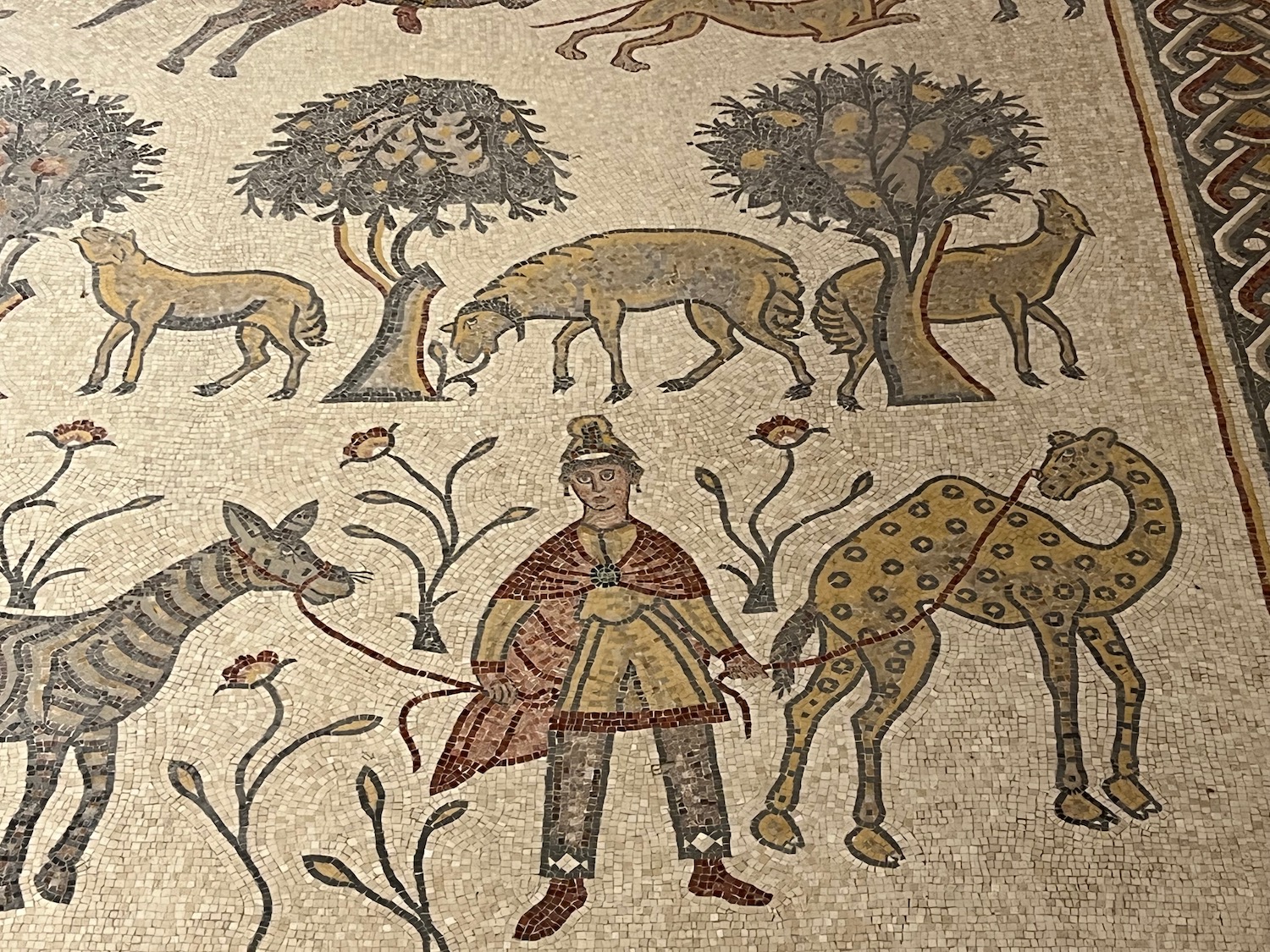 a mosaic of animals and a man
