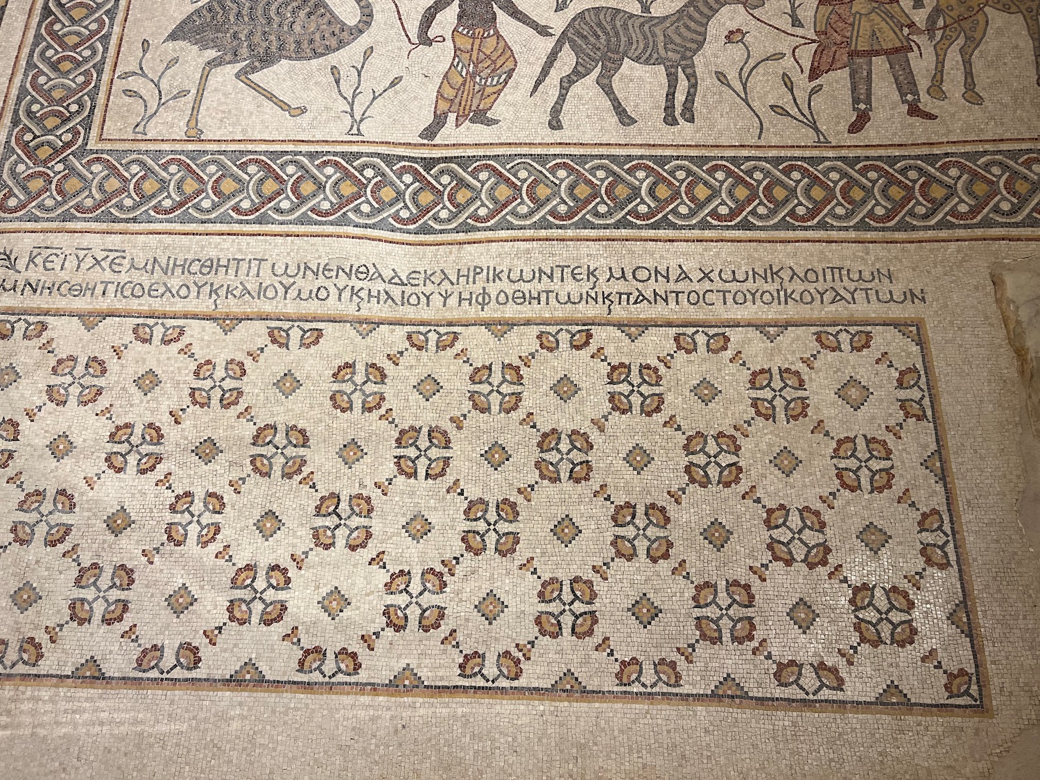 a mosaic with animals and birds