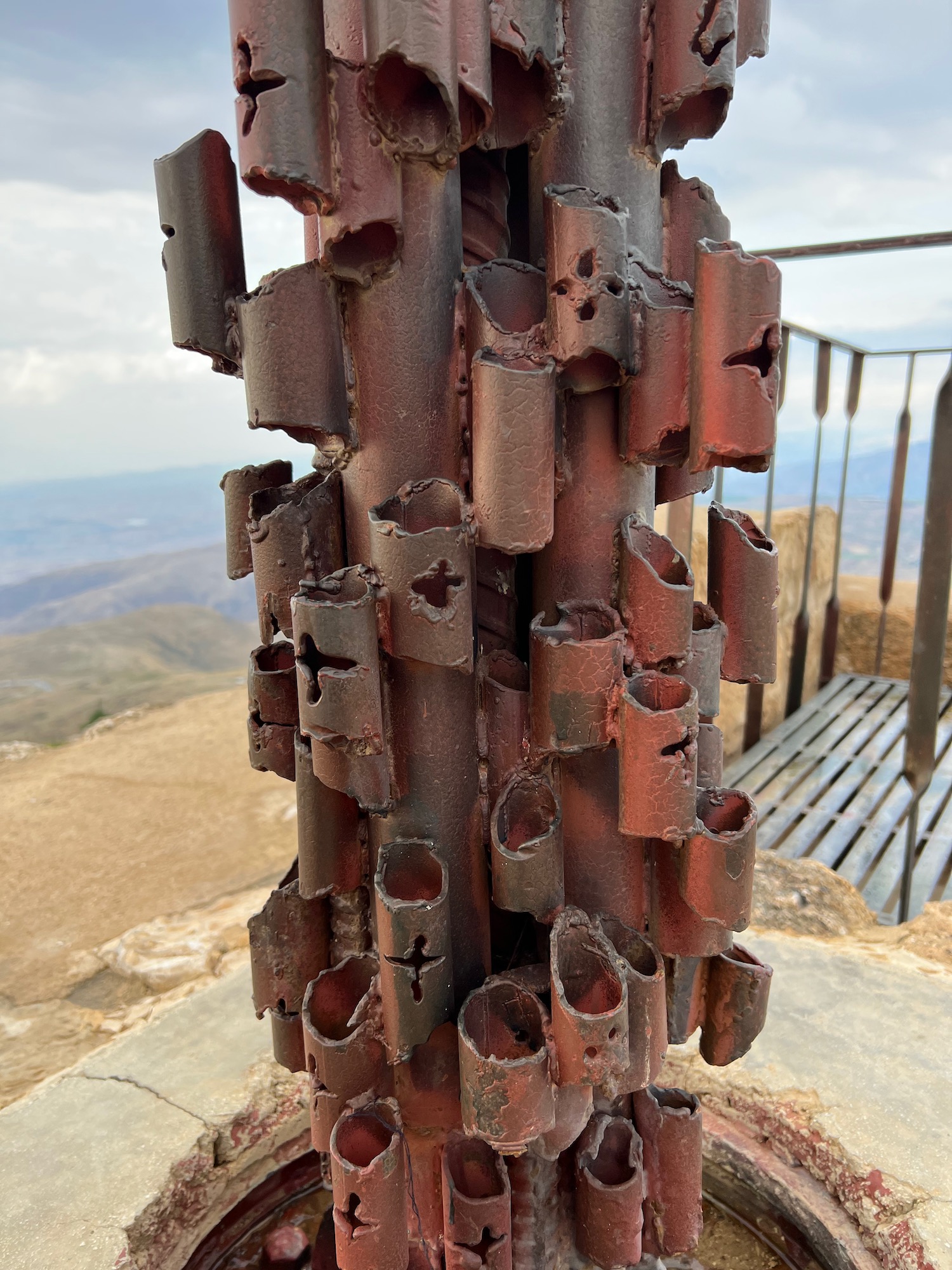 a metal sculpture on a rock