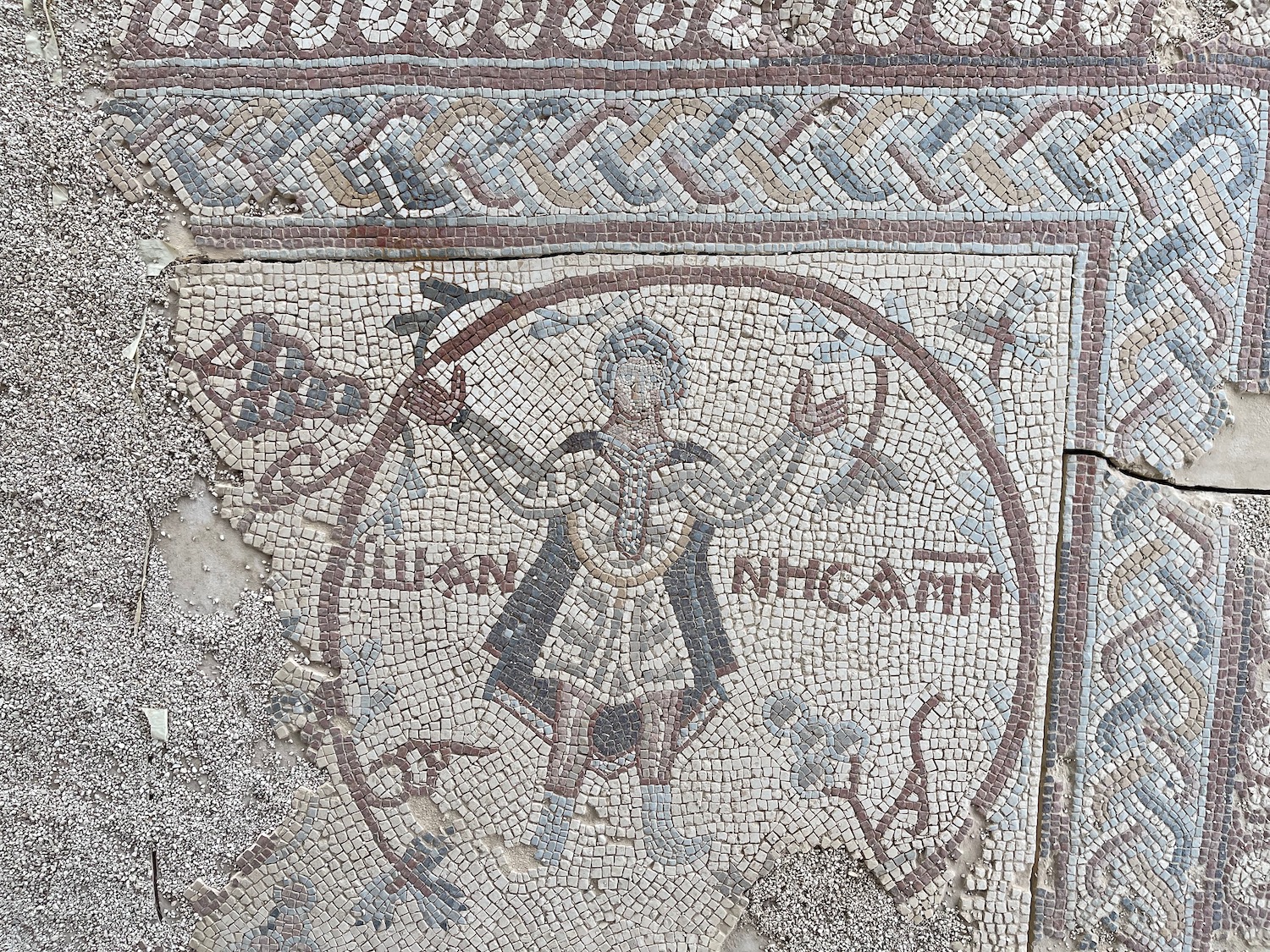a mosaic of a man holding a spear
