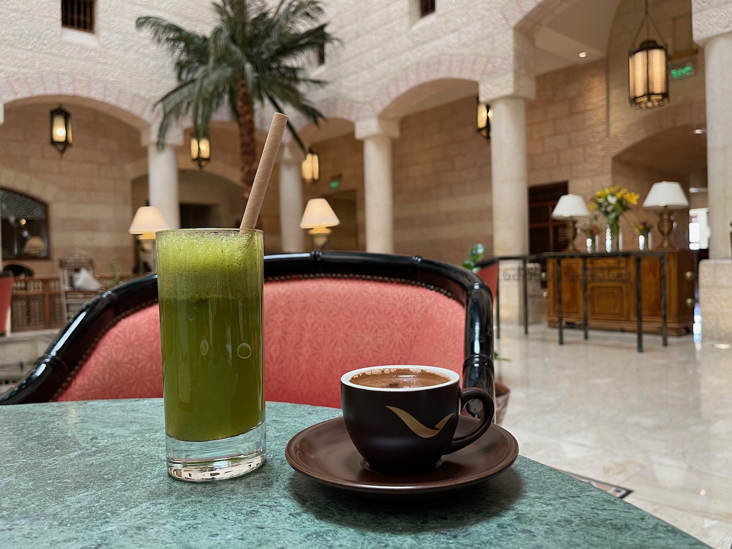 a cup of coffee and a drink on a table