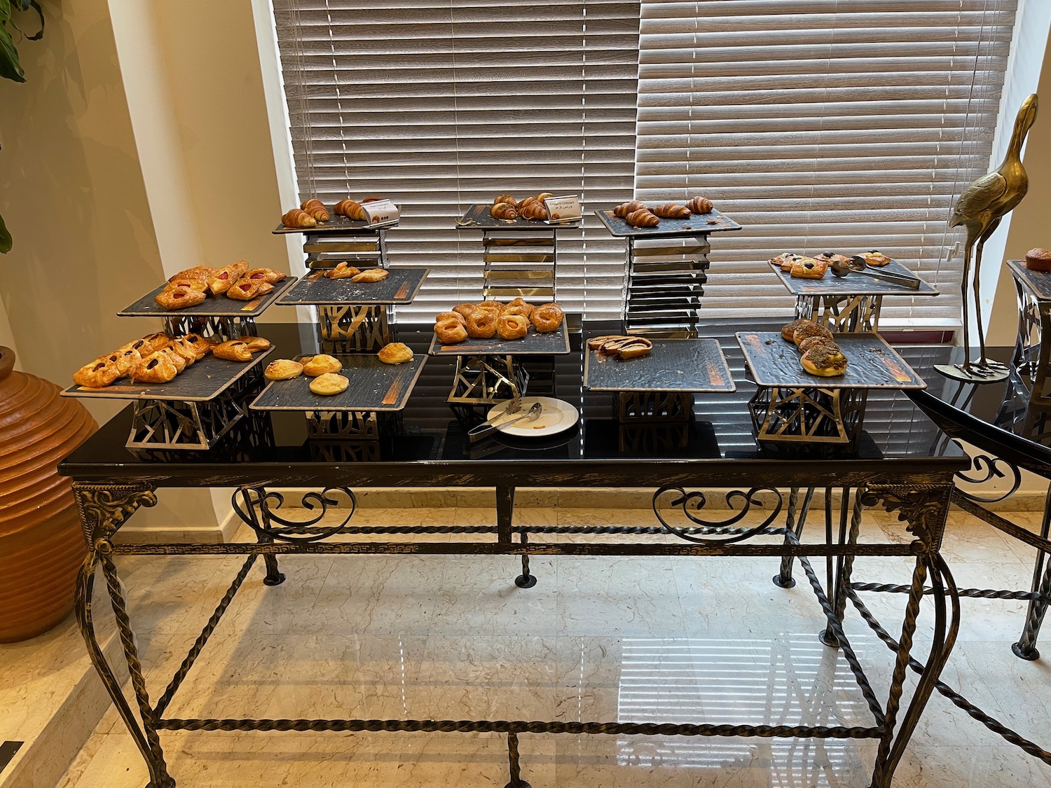 a table with trays of pastries