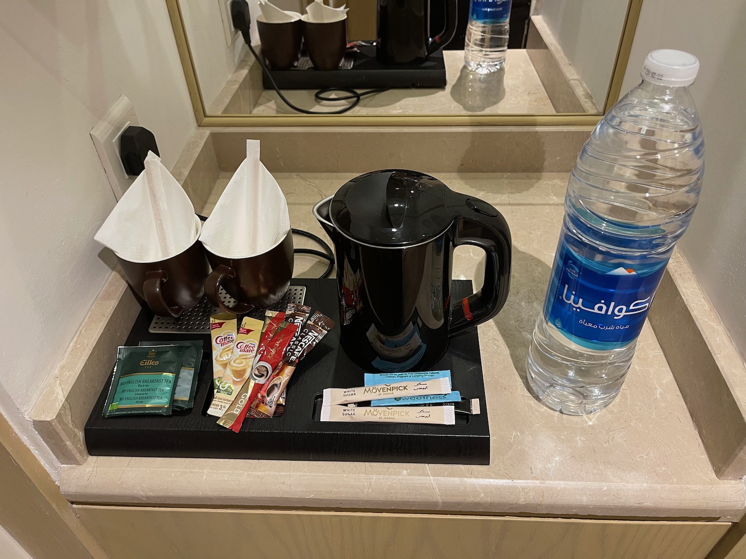 a coffee pot and other items on a counter