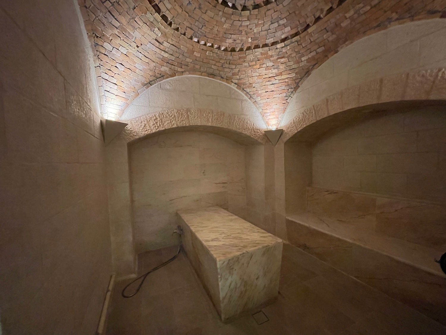 a stone bench in a room