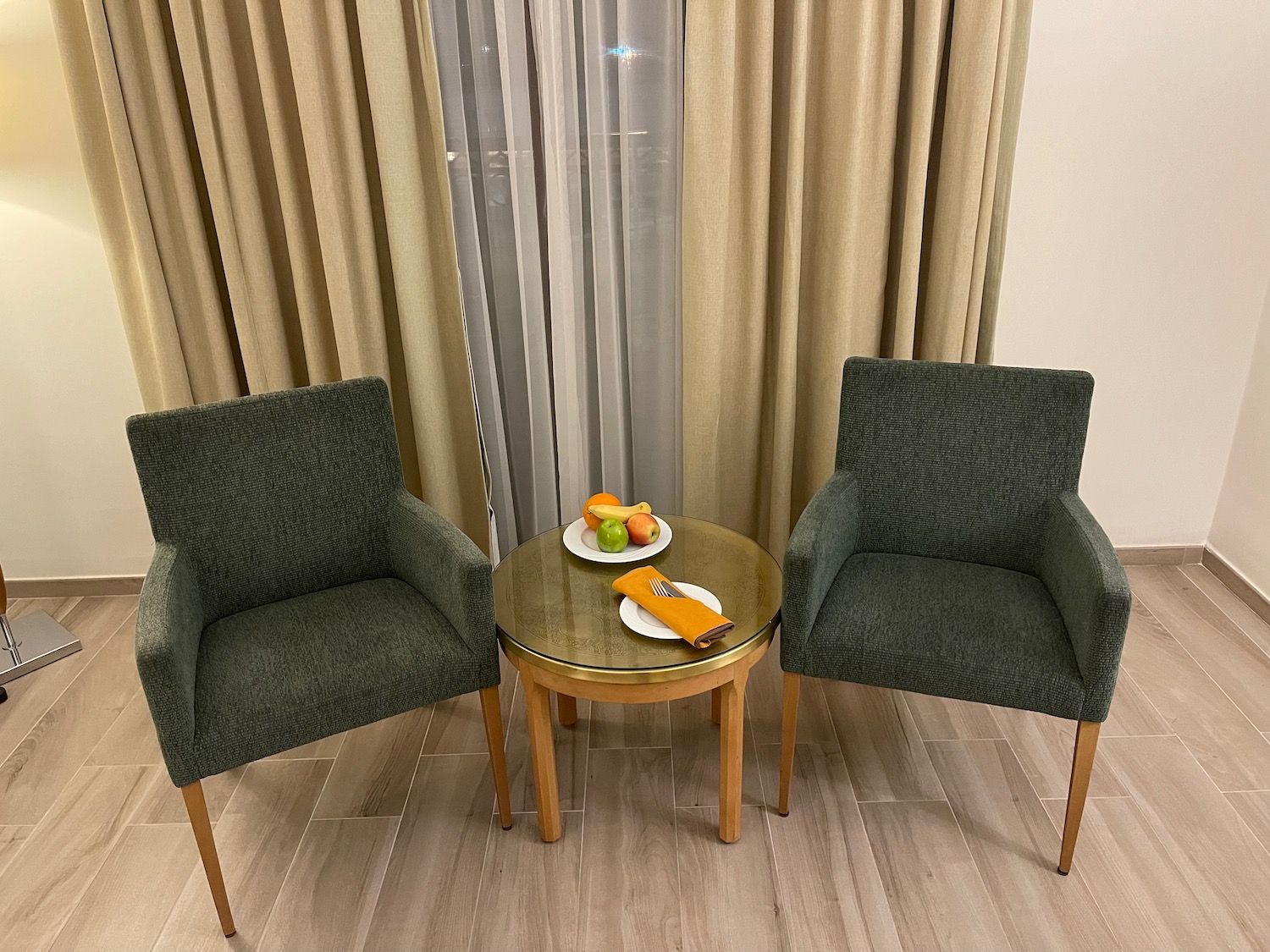 two chairs next to a table