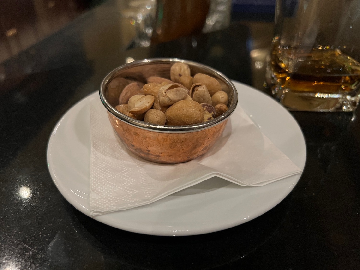 a bowl of nuts on a plate