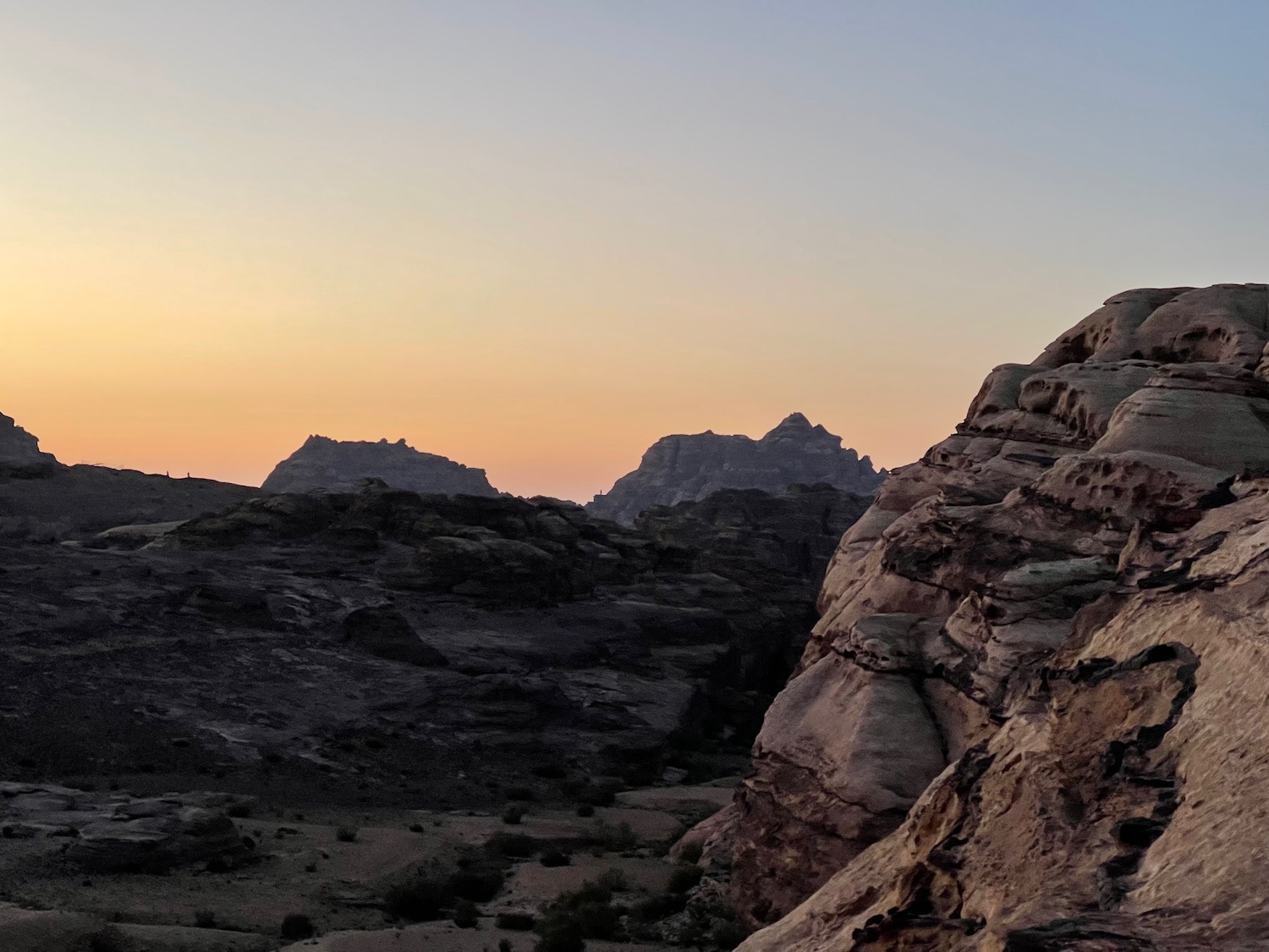 a rocky landscape with a sunset