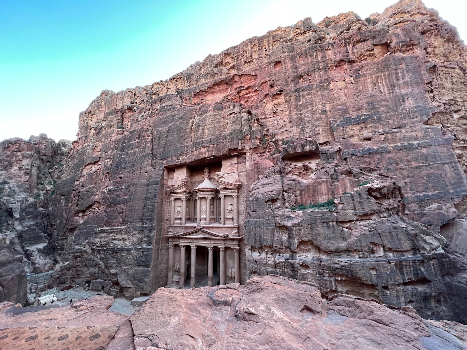 a stone building in a cliff