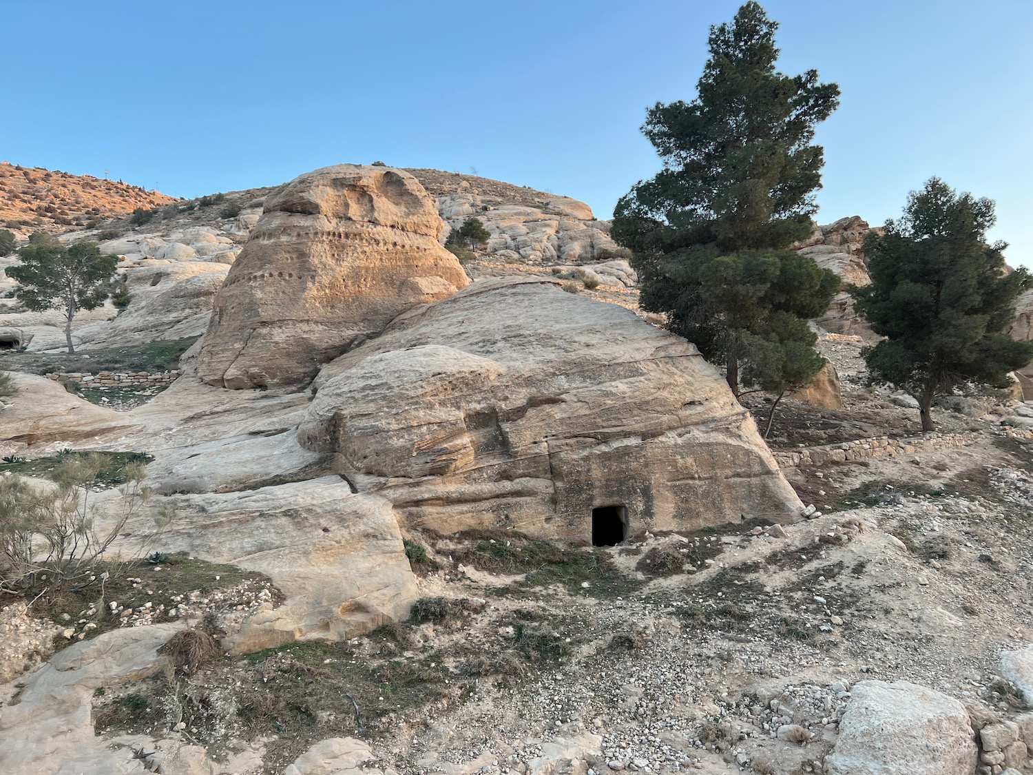 a rock formation with a small hole in it