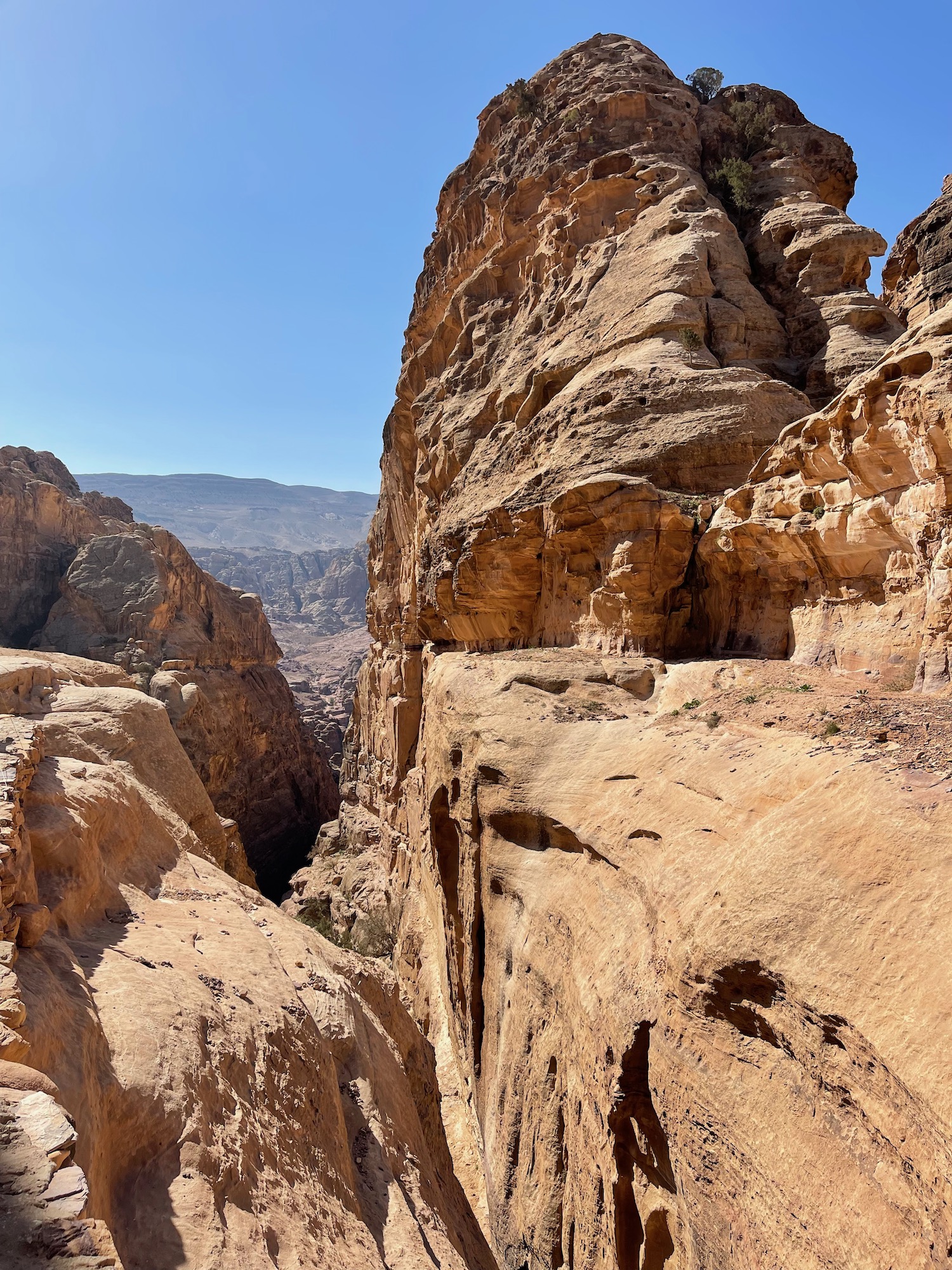 a rocky canyon with blue sky
