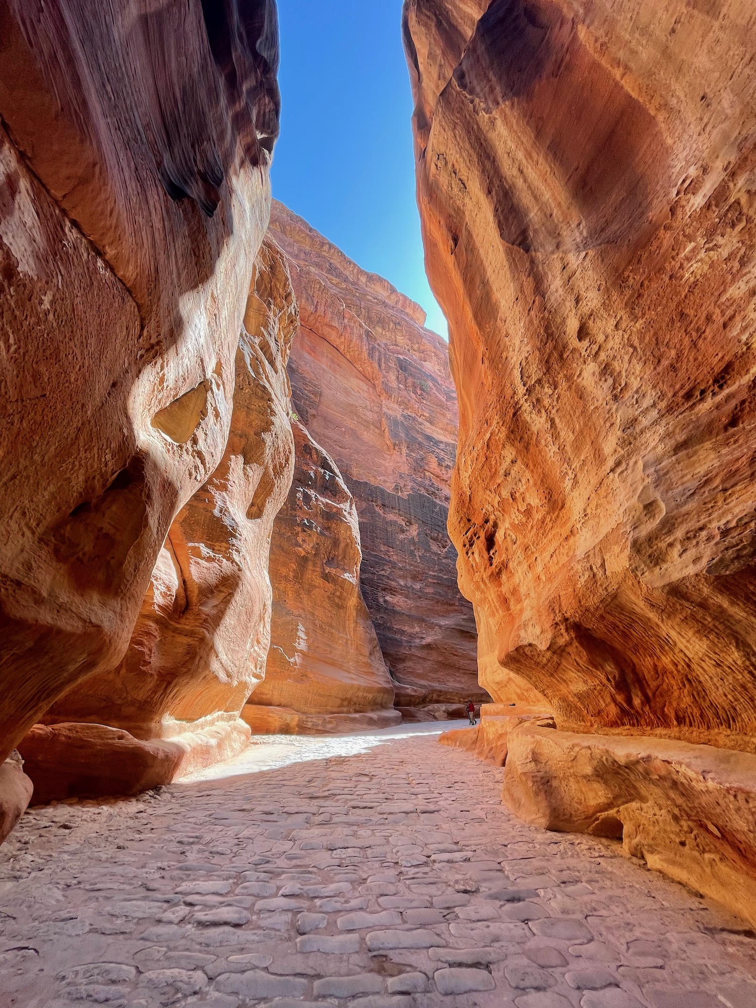 a stone path between large rocks